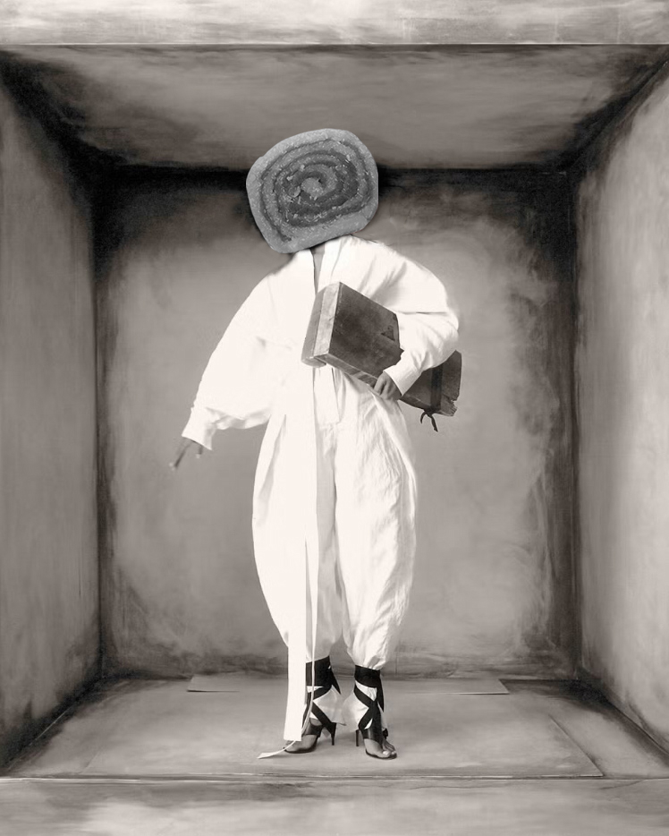 solange standing in white jumper with black shoes and handbag